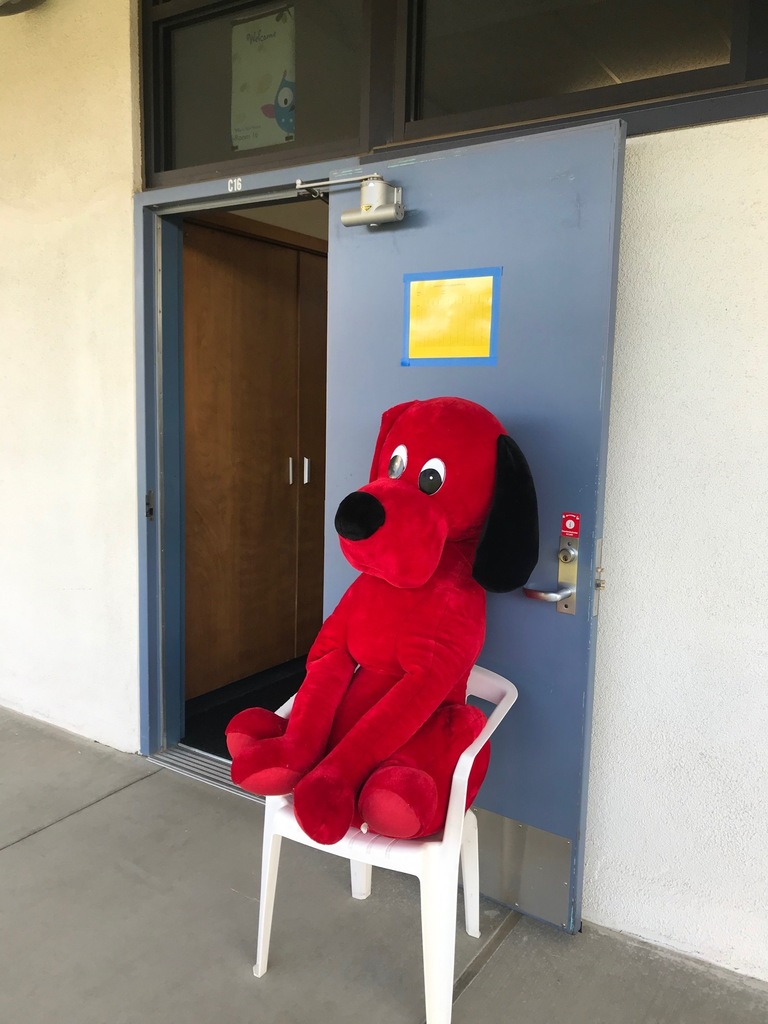 Clifford stuffed animal outside teacher's classroom door